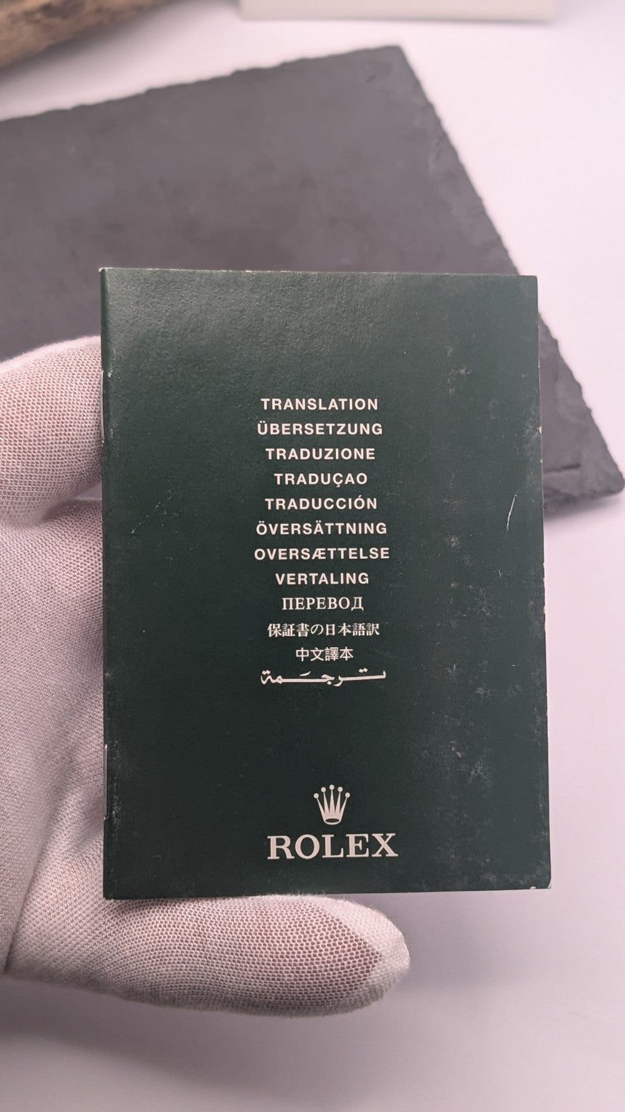 Genuine Rolex booklet holder in green PVC, designed to store warranty booklets,